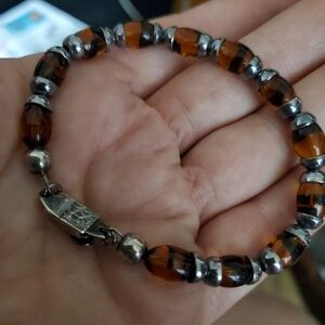 Bracelet - Rosary made of glass beads in amber color.